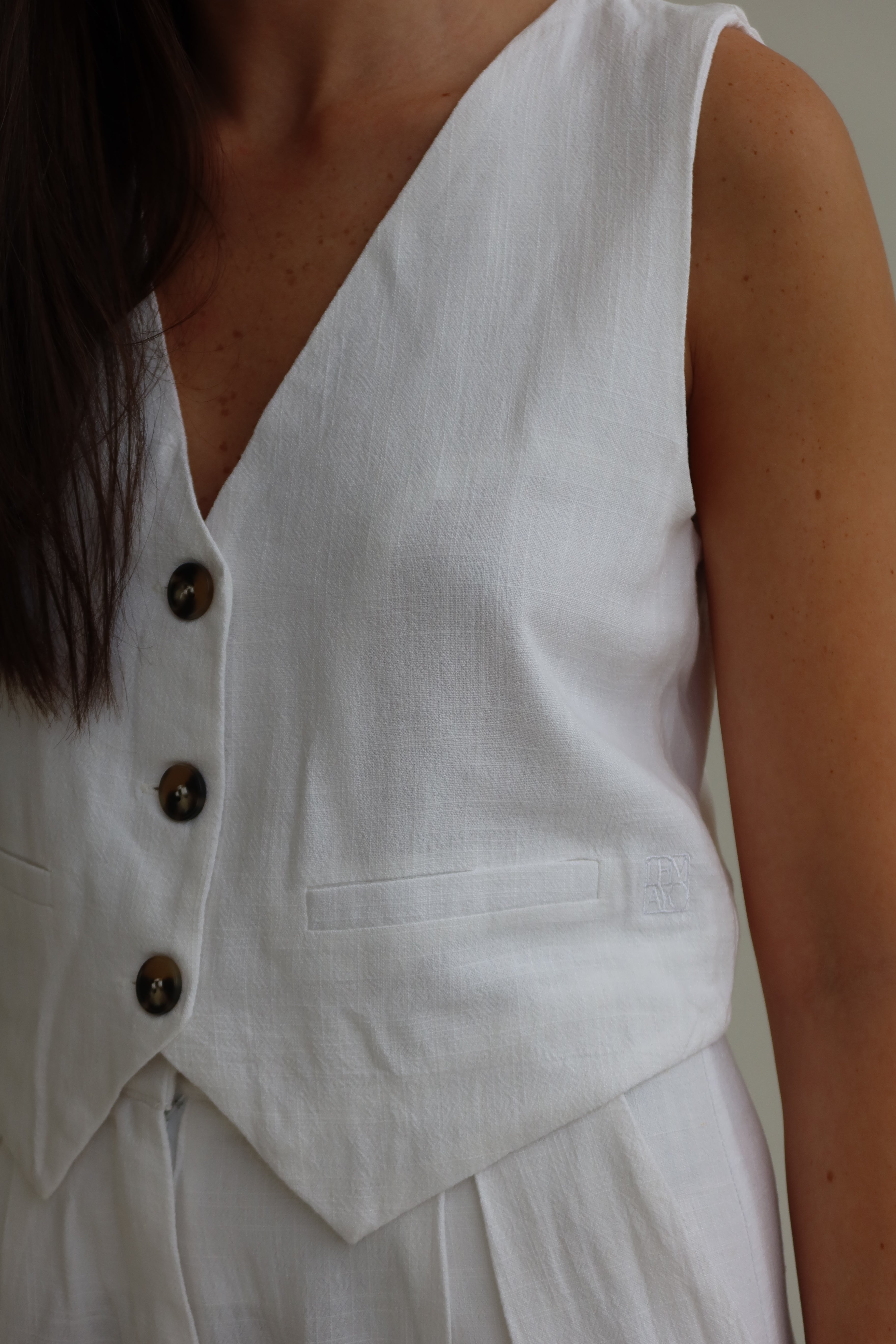 White tailored crop vest